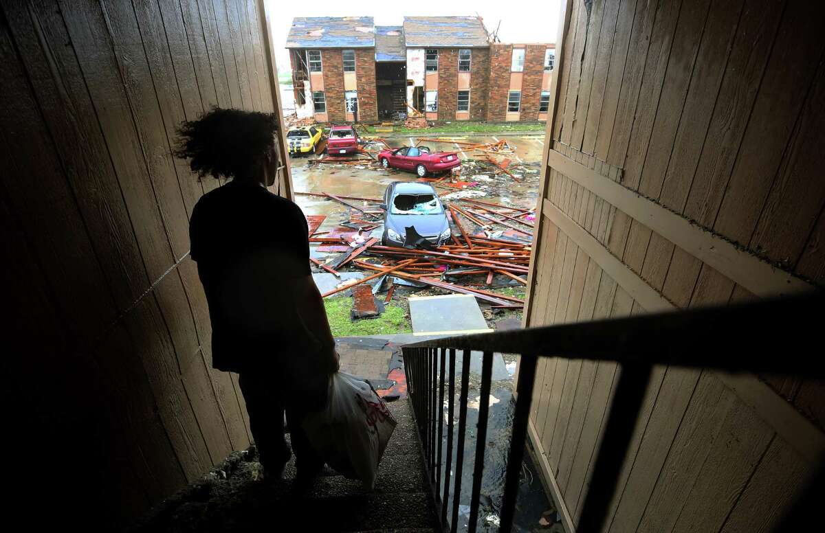 Nathan Kaufman stands on the stairwell of the apartment complex he lived in before Hurricane Harvey Saturday, Aug. 26, 2017, in Rockport, Texas.