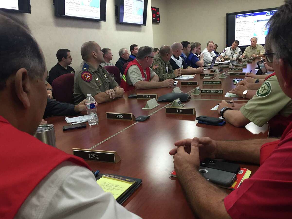 Gov. Greg Abbott hears from state operations personnel in Austin about the latest weather predictions and flooding concerns early afternoon Saturday, Aug. 26, 2017, before Hurricane Harvey was downgraded from a Category 1 Hurricane to a tropical storm.