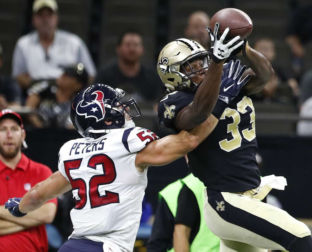 New Orleans Saints running back Trey Edmunds (33) makes a catch downfield against Houston Texans linebacker Brian Peters (52) during the fourth quarter of an NFL pre-season football game at the Mercedes-Benz Superdome on Saturday, Aug. 26, 2017, in New Orleans. ( Brett Coomer / Houston Chronicle )