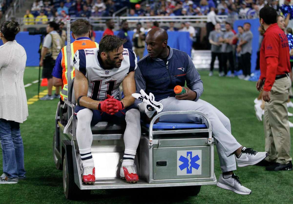 New England Patriots wide receiver Julian Edelman (11) is taken off the field on a cart during the first half of an NFL preseason football game against the Detroit Lions, Friday, Aug. 25, 2017, in Detroit. (AP Photo/Duane Burleson) ORG XMIT: DTF114
