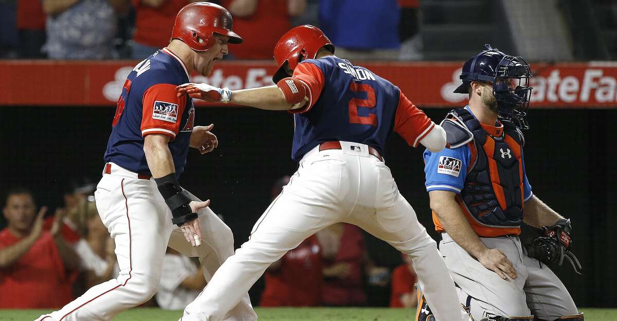 PHOTOS: Angels 7, Astros 6 Los Angeles Angels' Andrelton Simmons, center, celebrates his three-run home run with Kole Calhoun, left, as Houston Astros catcher Brian McCann looks away during the eighth inning of a baseball game in Anaheim, Calif., Saturday, Aug. 26, 2017. (AP Photo/Alex Gallardo) Browse through the photos to see action from the Astros' loss on Saturday night.