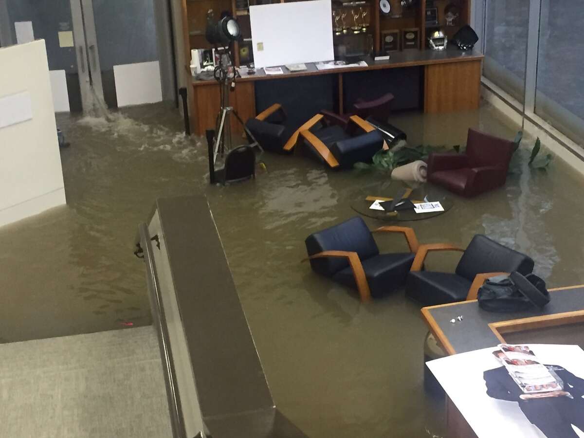 Office chairs sit in flood waters inside the KHOU offices during Hurricane Harvey, Sunday, Aug. 27, 2017.