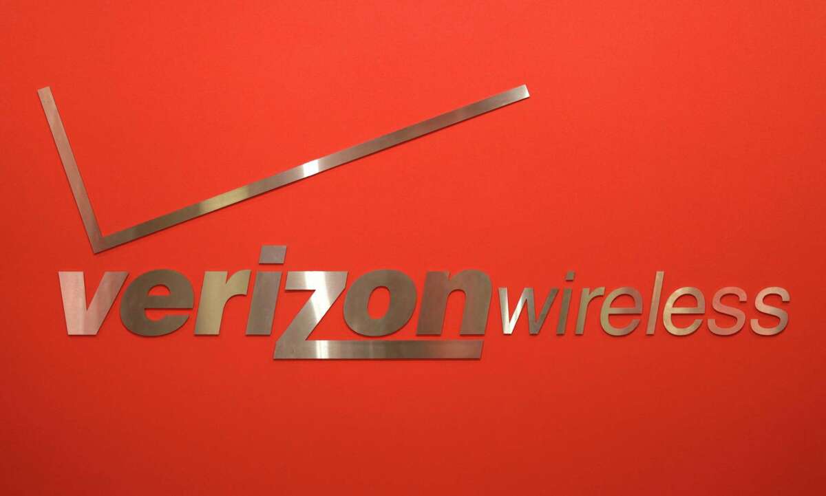 FILE - This Feb. 10, 2011, file photo, shows a Verizon Wireless logo at one of its stores in New York. Verizon Communications Inc. reported Thursday, April 19, 2012, a net income of $1.69 billion, or 59 cents per share, in the first three months of 2012, beating the average forecast of analysts by a penny per share. It was up from $1.44 billion, or 51 cents per share, a year ago. (AP Photo/Seth Wenig, File)