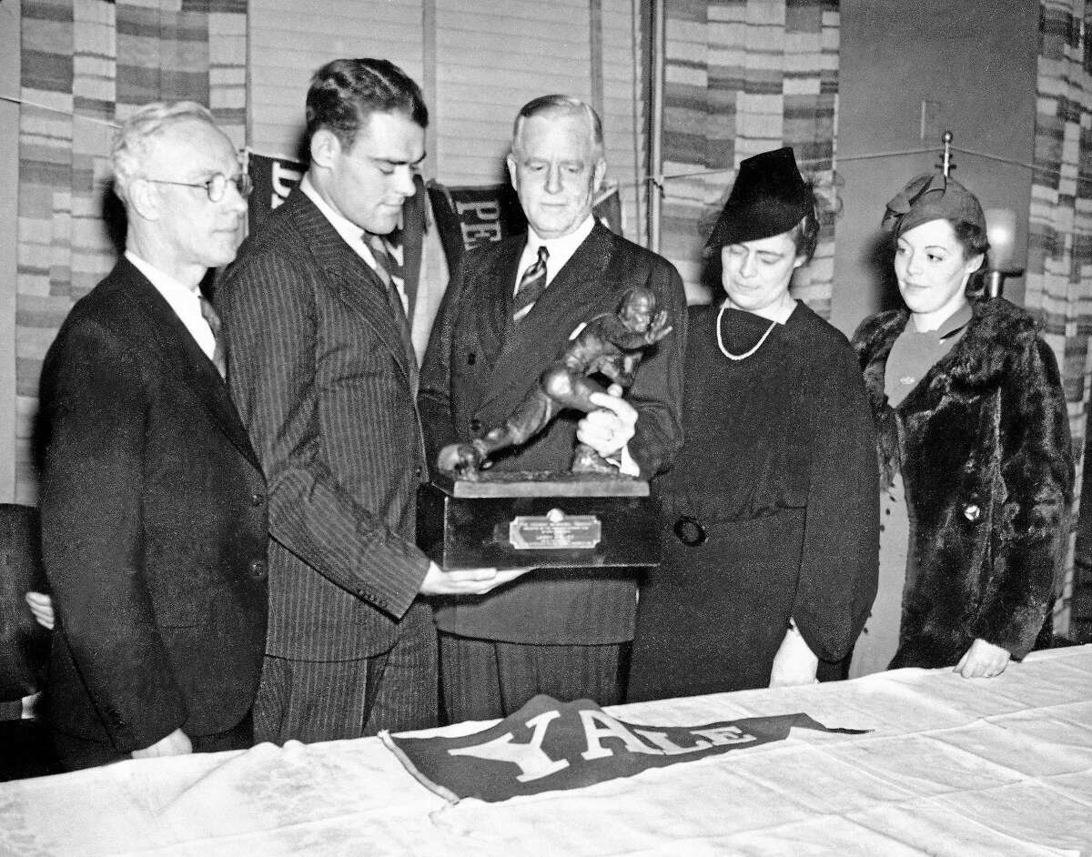 Yale end Larry Kelley, second from left, won the Heisman Trophy on Dec. 16, 1936 in New York.