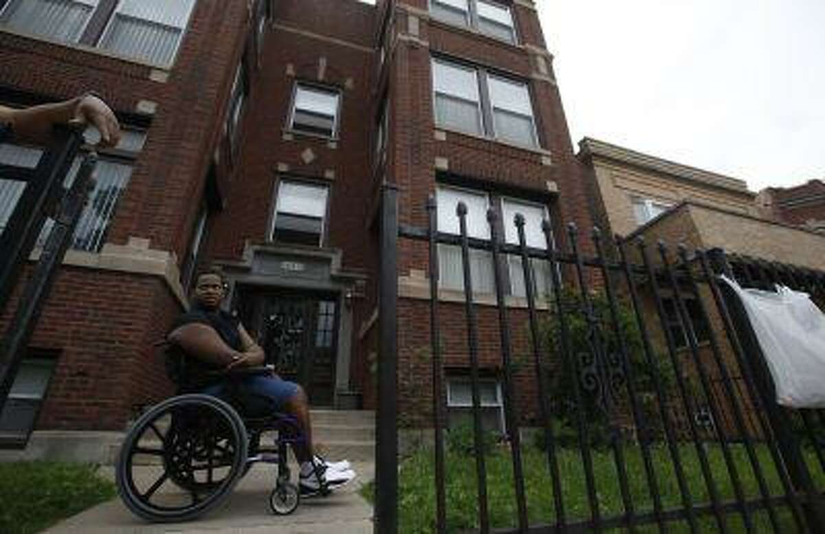 Miles Turner sits in front of his home in Chicago, Illinois, June 9, 2013. Turner, who was shot at least five times on a Chicago sidewalk last October, represents a largely untold side of the gun violence story. It's about the survivors who must live with costly and often permanently debilitating injuries.