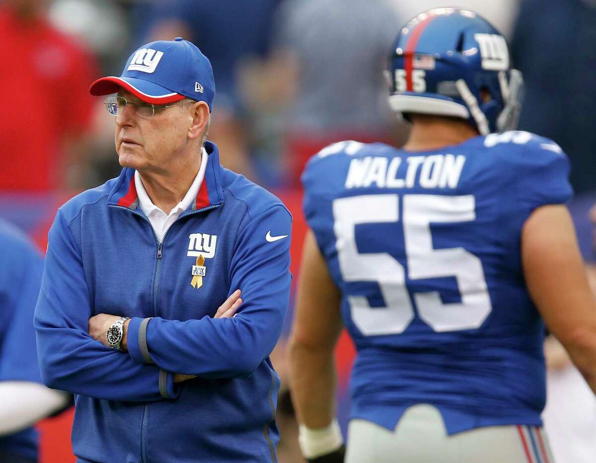 Giants head coach Tom Coughlin watches warmups before Sunday’s game against the Houston Texans.