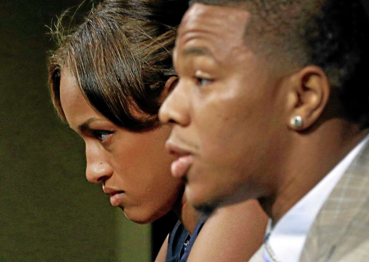 Janay Rice looks on as her husband, Baltimore Ravens running back Ray Rice, speaks during a news conference on Friday at the team’s practice facility in Owings Mills, Maryland.