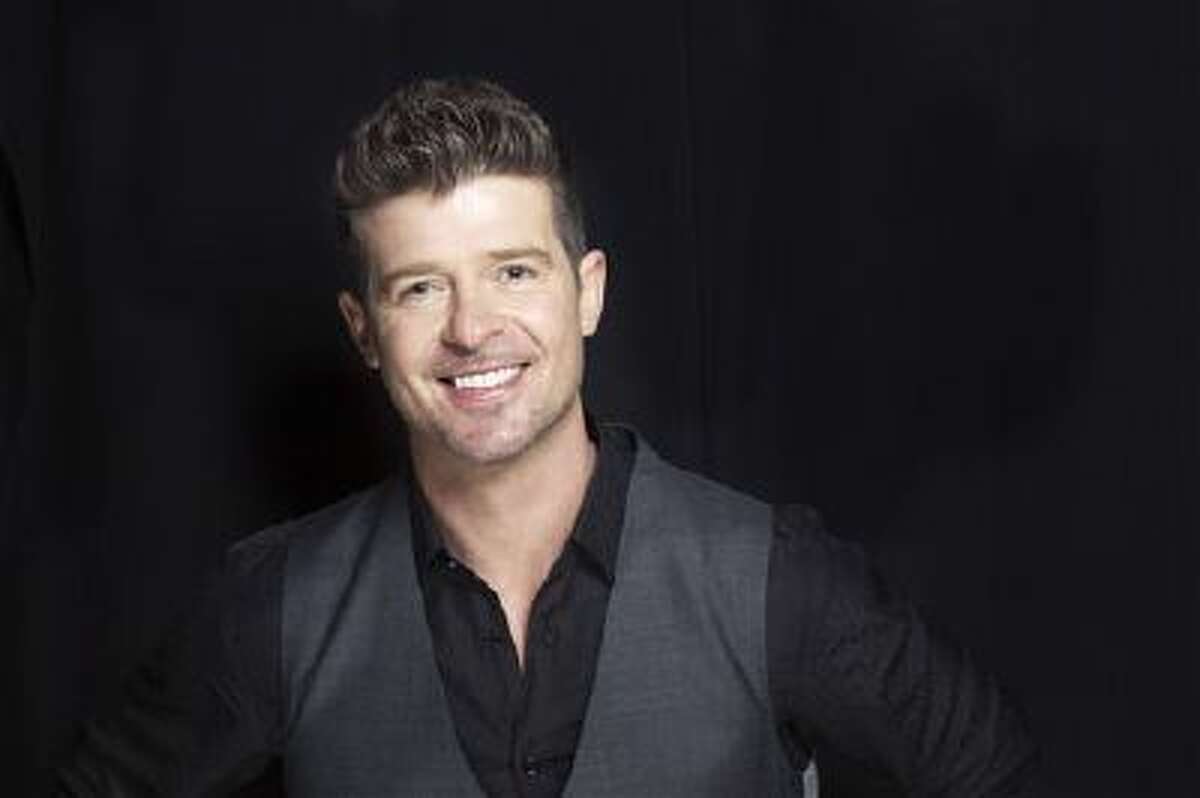 This Aug. 1, 2013 file photo shows R&B singer-songwriter Robin Thicke in New York. Two of Marvin Gaye's children, Nona and Frankie Gaye, countersued Thicke and his collaborators on the hit song "Blurred Lines" on Wednesday, Oct. 30, 2013, in Los Angeles claiming the singers improperly copied their father's hit "Got to Give It Up."