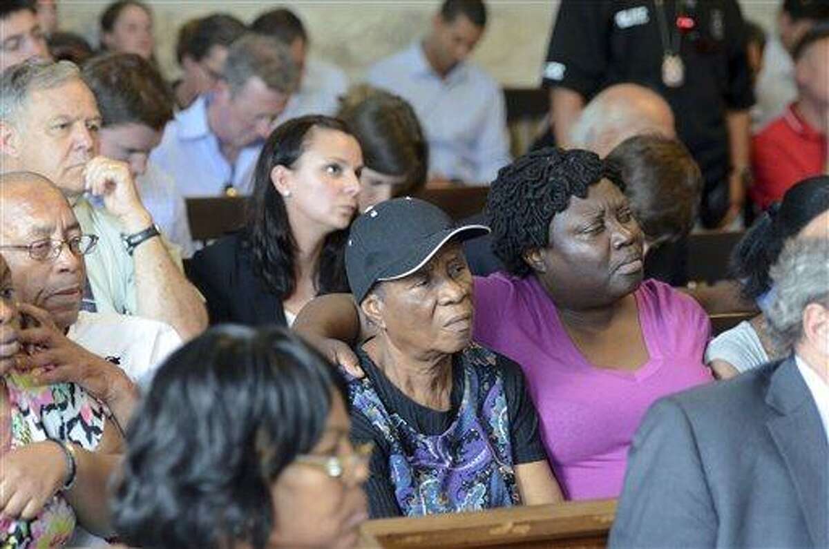 Family of Odin Lloyd reacts during the arraignment of former New England Patriots tight end Aaron Hernandez in Attleboro District Court Wednesday, June 26, in Attleboro, Mass. Hernandez was charged with murdering Lloyd, a 27-year-old semi-pro football player for the Boston Bandits, whose body was found June 17 in an industrial park in North Attleborough, Mass. (AP Photo/The Sun Chronicle, Mike George, Pool)