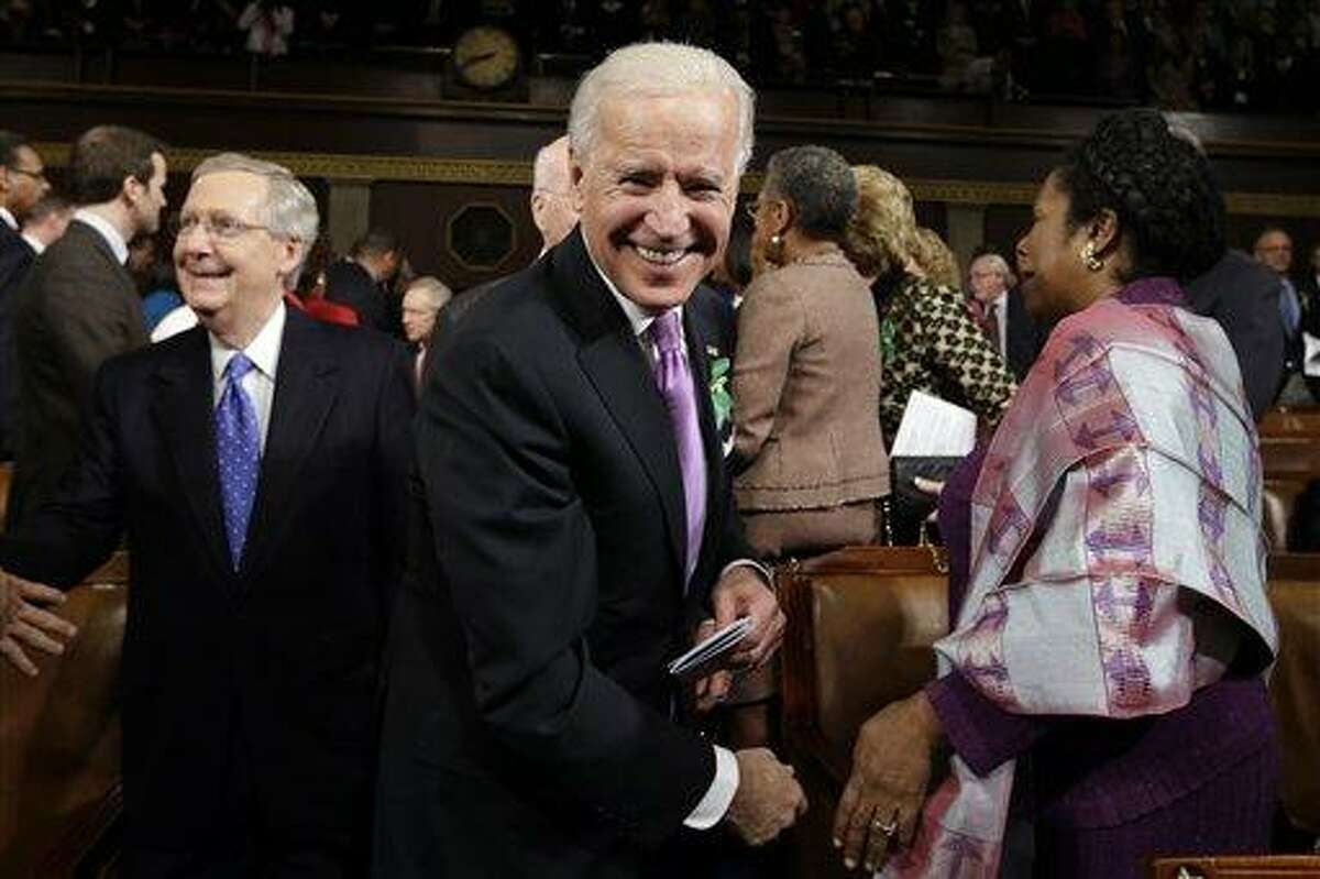 Vice President Joe Biden, Senate Minority Leader Mitch McConnell of Ky., left, Rep. Shelia Jackson Lee, D-Texas, right, and others arrive on Capitol Hill in Washington, Tuesday, Feb. 12, 2103, for President Barack Obama's State of the Union address during a joint session of Congress. (AP Photo/Charles Dharapak, Pool)