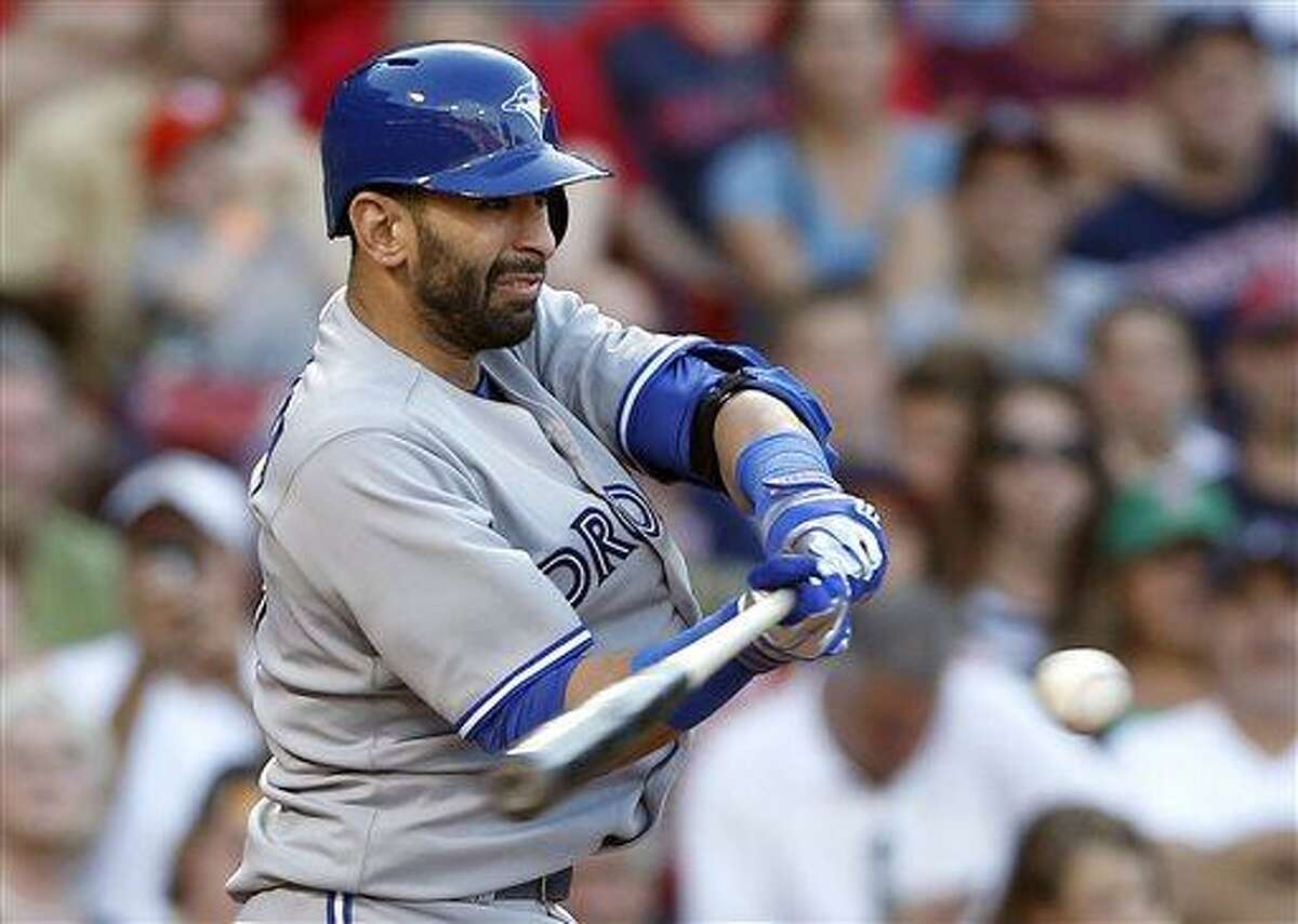 Toronto Blue Jays' Jose Bautista hits an RBI double in the ninth inning of a baseball game against the Boston Red Sox in Boston, Saturday, June 29, 2013. Bautista was out trying to advance to third. The Blue Jays won 6-2. (AP Photo/Michael Dwyer)
