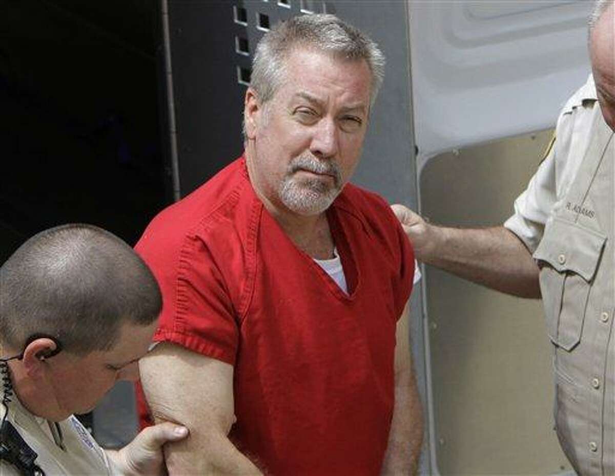 FILE - In this May 8, 2009 file photo, former Bolingbrook, Ill., police sergeant Drew Peterson arrives at the Will County Courthouse in Joliet, Ill., for his arraignment on charges of first-degree murder in the 2004 death of his former wife Kathleen Savio, who was found in an empty bathtub at home. Peterson's wisecracking, limelight-hogging, sunglasses-wearing lawyers faced the media horde every day of the former suburban Chicago police officer's 2012 trial -- one that ended with a murder conviction and a falling out among the erstwhile colleagues. But the lawyerly war of words in public between lead trial counsel Joel Brodsky and former partner-turned-nemesis Steve Greenberg that began within hours of the trial's end will come to a head Tuesday, Feb. 19, 2013 at a hearing where the defense will argue Peterson deserves a new trial because Brodsky did a shoddy job. (AP Photo/M. Spencer Green, File)