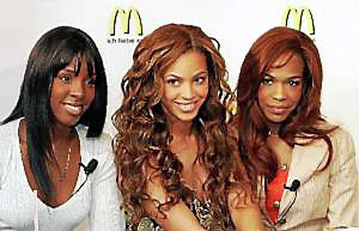 Kelly Rowland, left, Beyonce Knowles, center, and Michelle Williams, are shown in Hamburg, Germany, in this May 19, 2005, file photo.