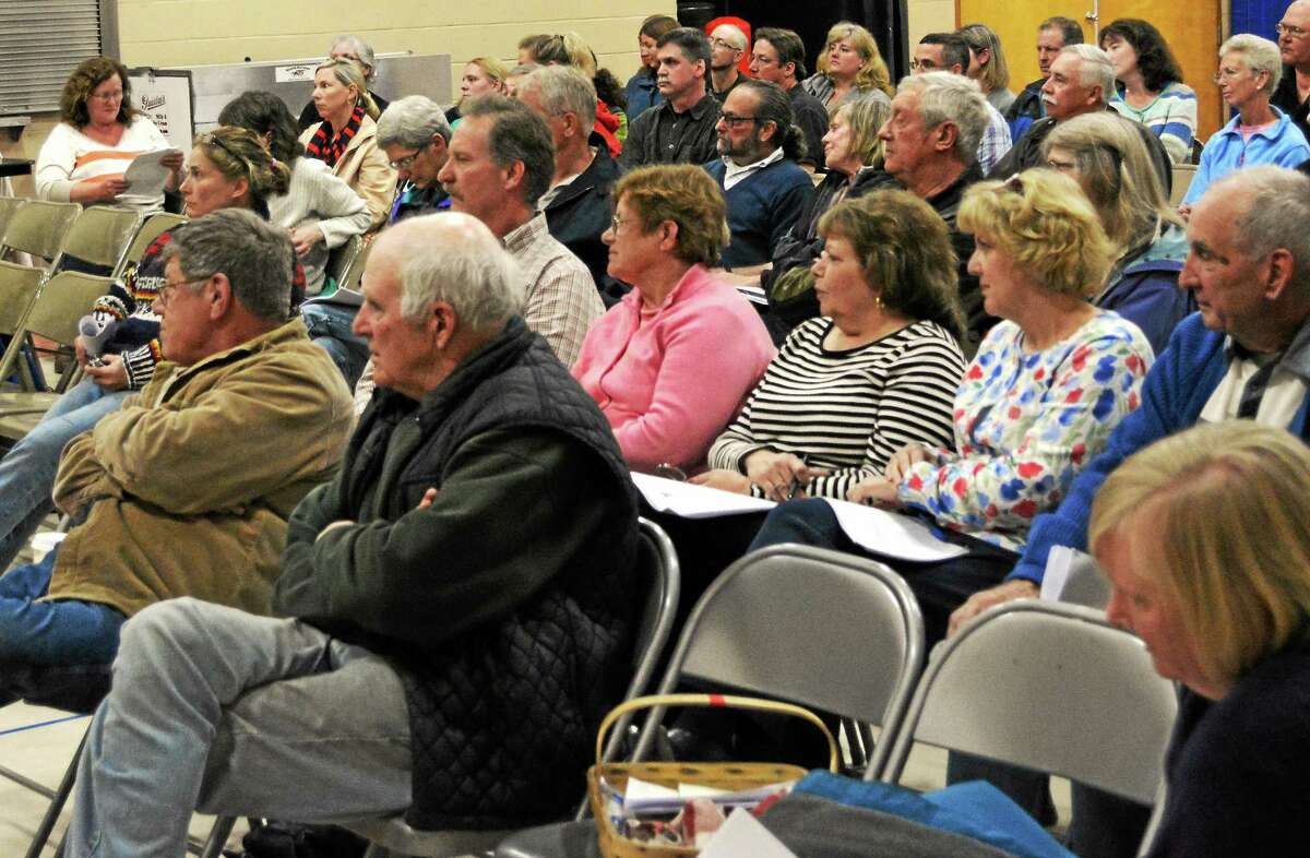 Colebrook residents listen during a presentation by the Regionalization Study Committee during an informational meeting Thursday. A proposed plan would close Colebrook Consolidated School and move its student population to Norfolkís Botelle School.