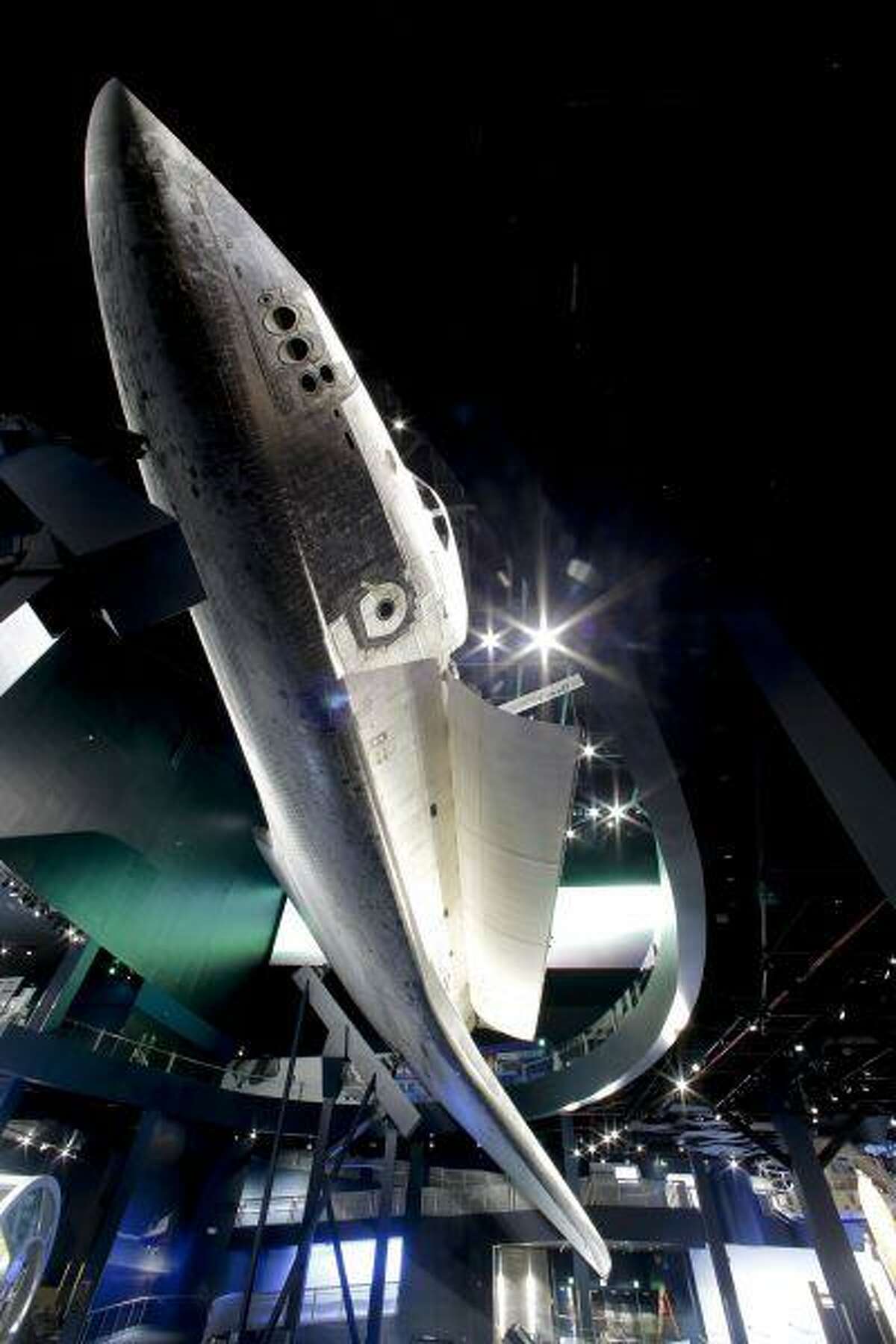 This June 20, 2013 photo shows the space shuttle Atlantis on display at the Kennedy Space Center Visitor Complex in Cape Canaveral, Fla. The 900,000 square-foot facility centering around the last shuttle to go into orbit will open to the public June 29. (AP Photo/John Raoux)