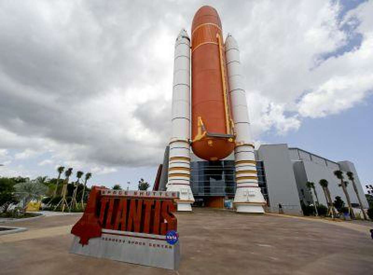This June 20, 2013 photo shows the entrance to the space shuttle Atlantis exhibit at the Kennedy Space Center Visitor Complex in Cape Canaveral, Fla. The 900,000 square-foot facility centering around the last shuttle to go into orbit will open to the public June 29. (AP Photo/John Raoux)