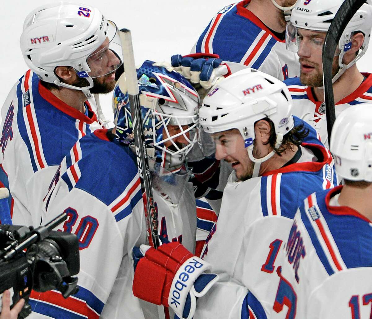 New York Rangers goalie Henrik Lundqvist is congratulated by teammates after defeating the Montreal Canadiens 3-1 in Game 2 of the Eastern Conference finals on Monday in Montreal.