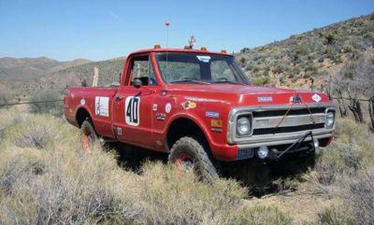 This photo provided by Courtesy of Mecum Auctions, a 1969 Chevrolet C/10 Baja race truck once owned by actor Steve McQueen is shown. McQueen's old truck and prescription sunglasses worn by John Lennon are among hundreds of items once owned by celebrities that are scheduled to be auctioned in California next month. The Mecum Auction Company said Wednesday, June 26, 2013, it will be displaying and auctioning about 2,000 pieces of celebrity-related memorabilia in Santa Monica, Calif. on July 26-27. Mecum, which specializes in the sale of collector cars, says one of the auction's highlights will be Elvis' 1972 Cadillac Custom Estate Wagon. "The King of Rock n' Roll" owned the car from 1972 until his death in 1977, according to Mecum's Web site. (AP Photo/Courtesy of Mecum Auctions, David Newhardt)