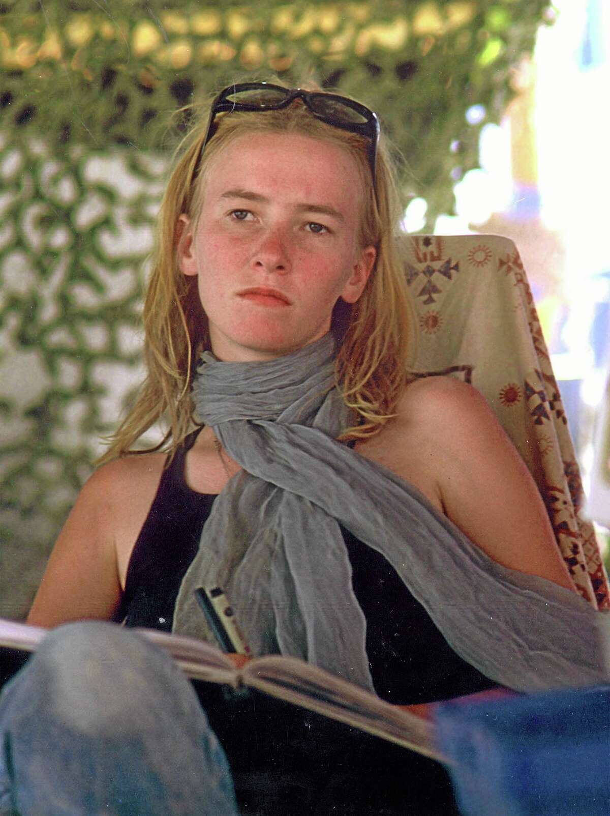 FILE - This Sept. 2002 file photo show activist Rachel Corrie is shown at the Burning Man festival in Black Rock City, Nev. The family of the slain American activist on Wednesday, May 21, 2014 appealed to the Israeli Supreme Court to overturn a lower court's ruling and hold the military accountable for their daughter's death. Corrie was crushed to death over a decade ago by an Israeli military bulldozer razing Palestinian homes in an area the army said militants used for cover, in the southern town of Rafah near the Gaza border with Egypt.(AP Photo/Denny Sternstein, File)