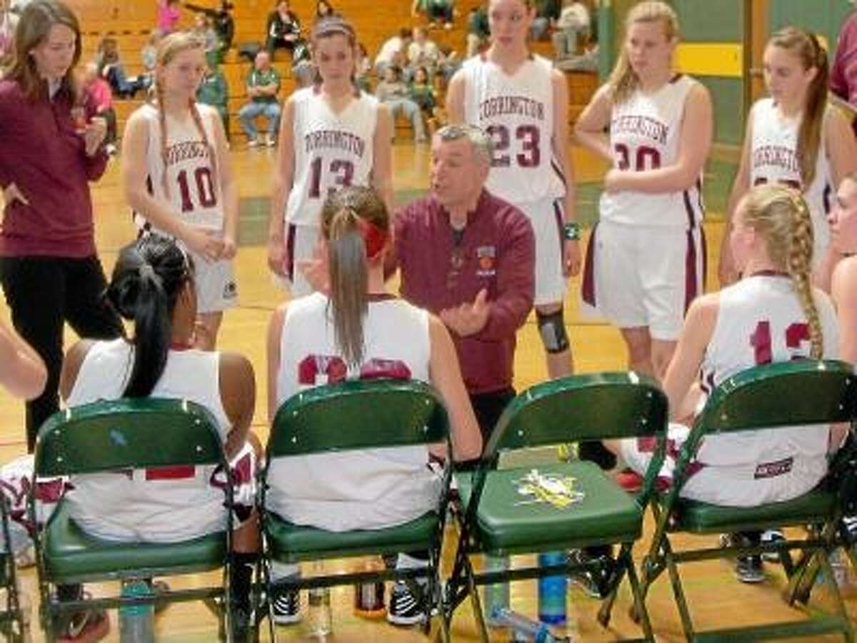 Torrington High School girls basketball coach Mike Fritch lays out the plan in Torrington's 61-39 NVL Quarterfinal win over Woodland Monday afternoon.