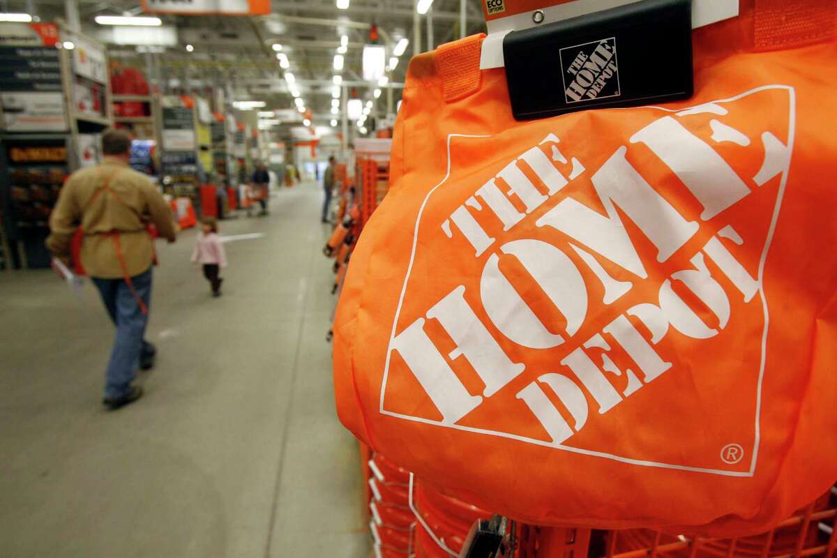 FILE - In this Feb. 22, 2010 file photo, shoppers walk through the aisles at the Home Depot store in Williston, Vt. The Home Depot on Thursday, Sept. 18, 2014 said it has eliminated malware from its U.S. and Canadian networks that affected 56 million unique payment cards between April and September.