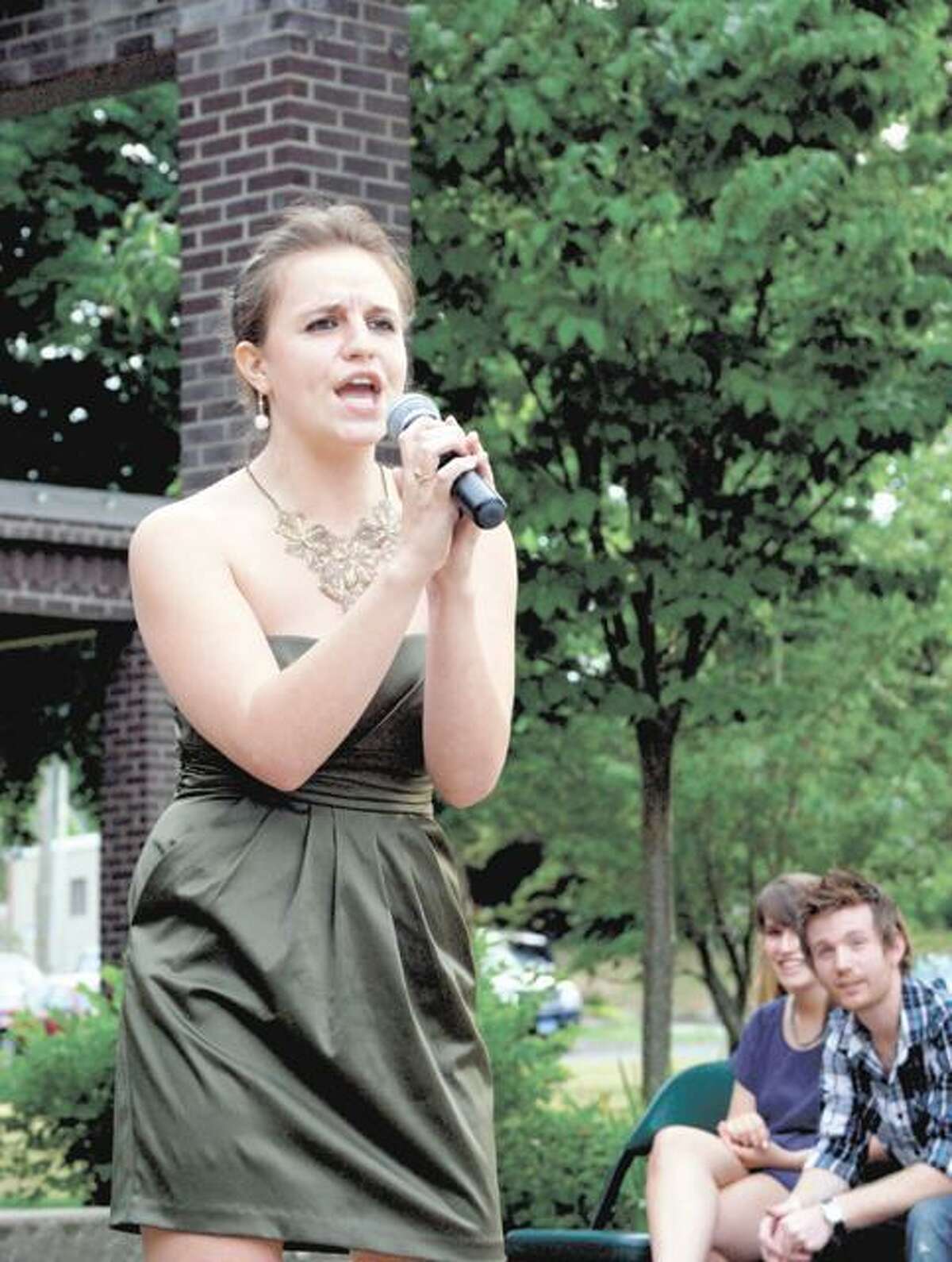 RONALD DeROSA/Register CitizenNorthwest Idol finalist Theresa Murphy, 18, performs "Hey Big Spender," by Peggy Lee, during the competition's semi finals on Saturday at Coe Memorial Park. Murphy, of Goshen, was one of six chosen to progress forward to the Aug. 8 final competition at the Warner Theatre.