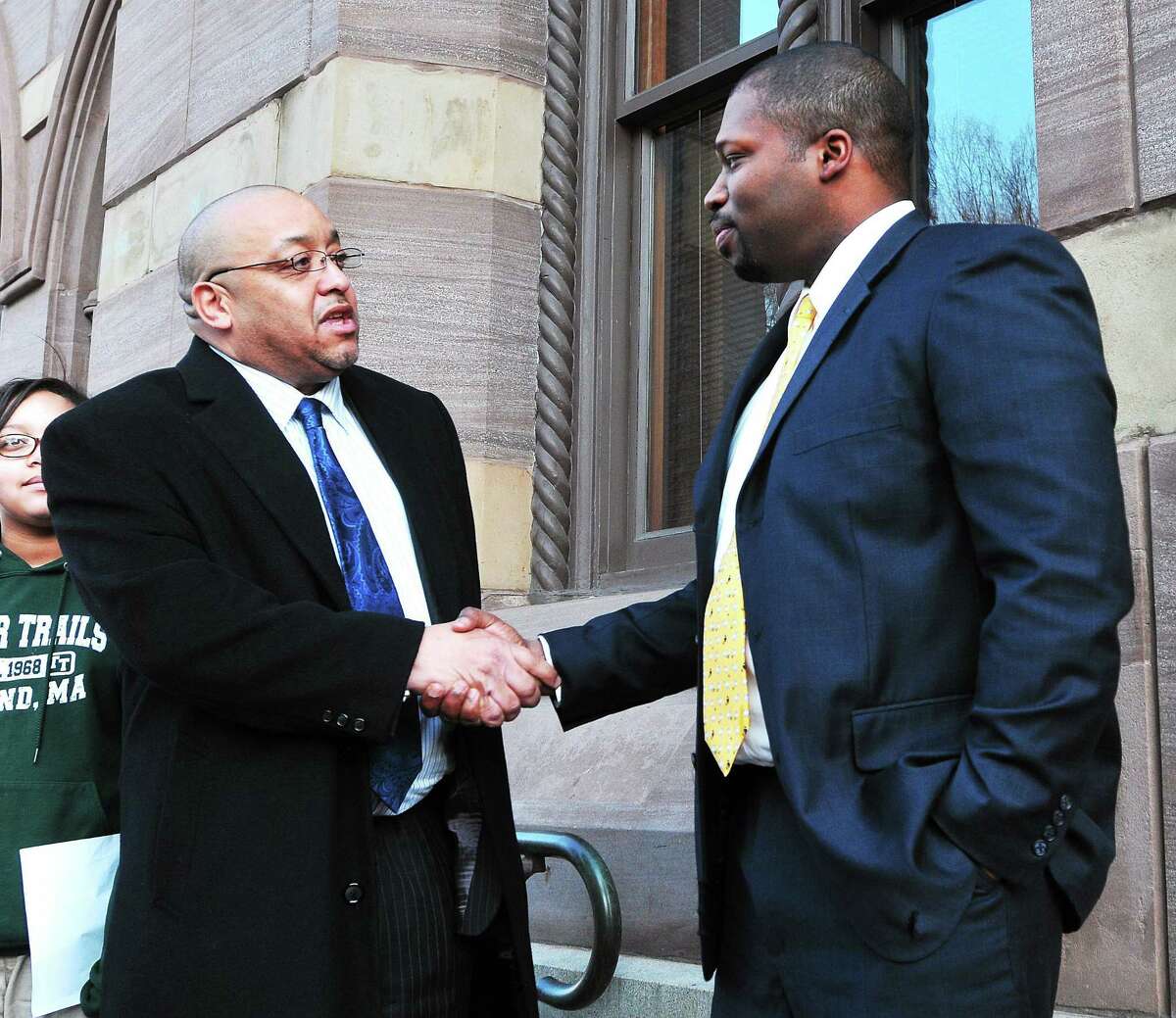 (Peter Casolino ó New Haven Register) Gary Holder-Windfield, right, gets a handshake from Darnell Goldson, after Goldson removed himself from the 10th district senate race in Connecticut. The two met outside New Haven City hall. Holder-Windfield is seeking the senate seat, formerly held by Toni Harp. pcasolino@NewHavenRegister
