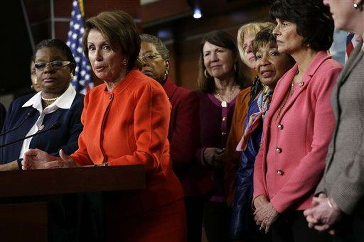House Minority Leader Nancy Pelosi of Calif., center, accompanied by fellow House Democrats, leads a news conference on Capitol Hill in Washington, Wednesday, Jan. 23, 2013, to discuss the reintroduction of the Violence Against Women Act. Congressional Democrats have renewed their push to revive the key federal program that protects women against domestic violence. They sought to diminish Republican objections that blocked passage of the legislation last year by removing a provision that would increase visas for immigrant victims of domestic abuse. Rep. Gwen Moore, D-Wis. is at left. (AP Photo/Jacquelyn Martin)