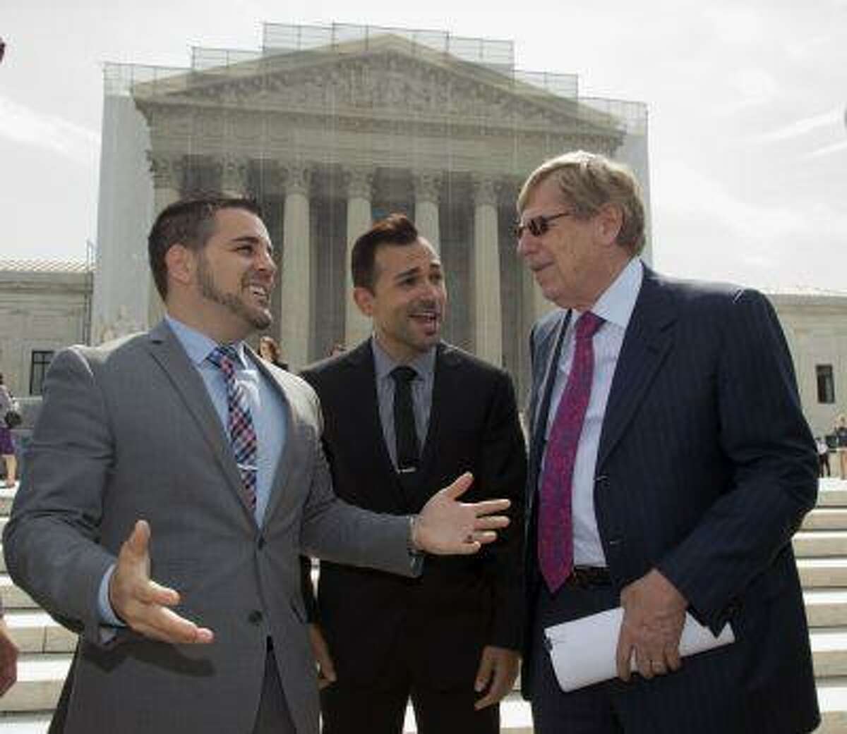 Ted Olson, right, attorney for the Proposition 8 plaintiffs, Jeff Zarrillo, left, and Paul Katami, center, talk outside the Supreme Court in Washington, Thursday, June 20, 2013, as they leave after a decision in their case on gay marriage, Hollingsworth v. Perry, was not announced today. With only a few days remaining in the court's term, several major cases are still outstanding that could have widespread political impact on same-sex marriage, voting rights, and affirmative action. (AP Photo/J. Scott Applewhite)