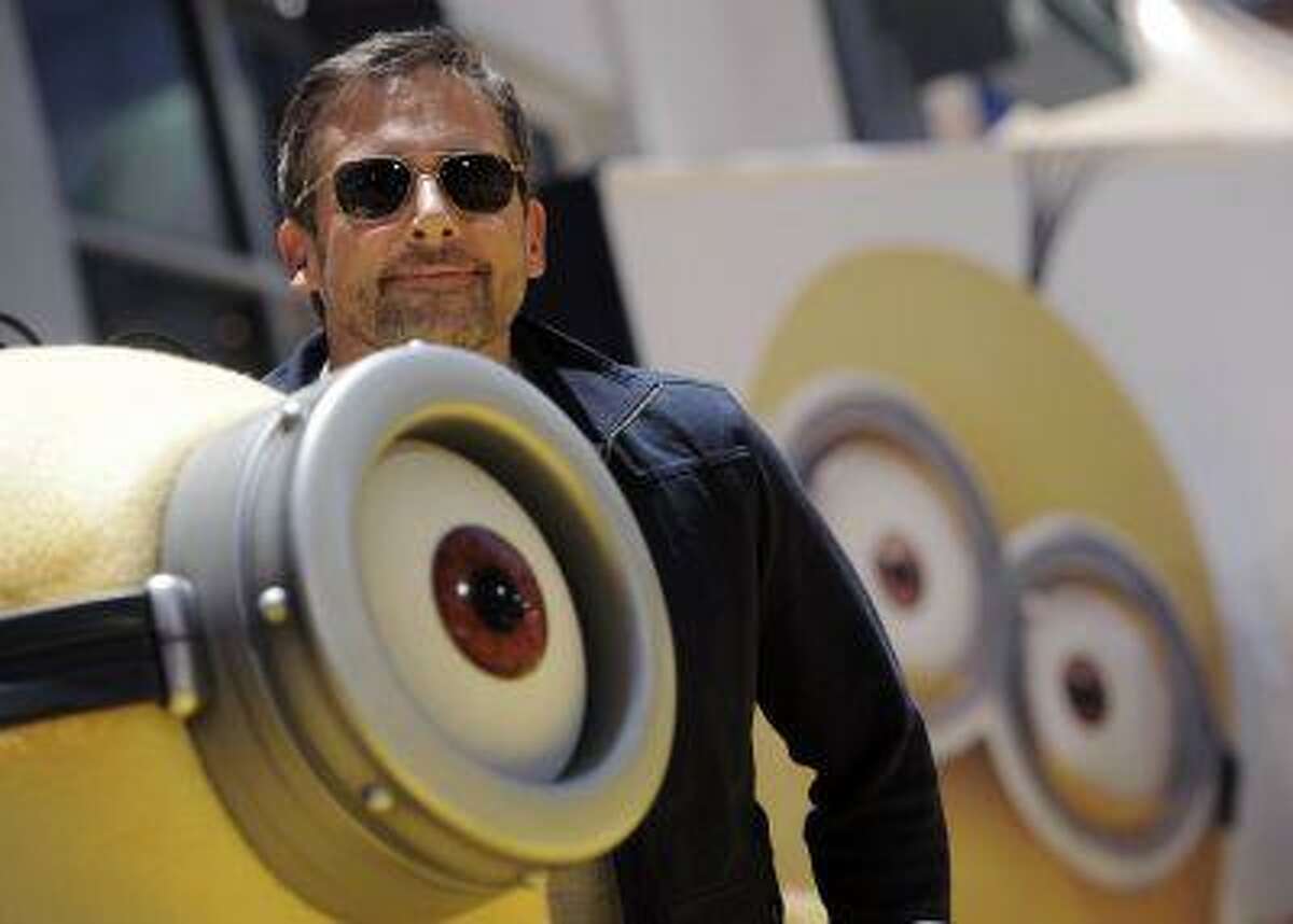 Steve Carell, a cast member in the "Despicable Me 2," poses alongside a minion character from the film at the American premiere of the film at Universal Citywalk on Saturday, June 22, 2013 in Universal City, Calif. (Photo by Chris Pizzello/Invision/AP)