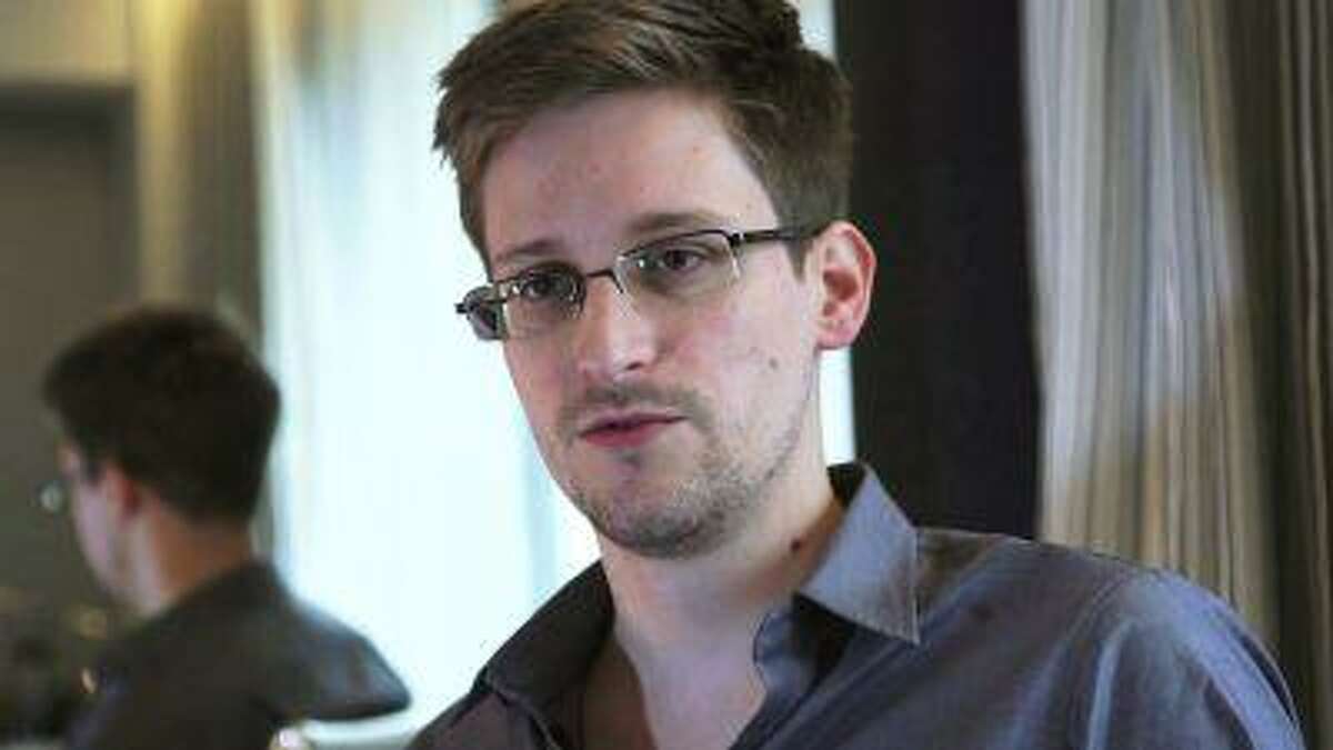 File photo of NSA whistleblower Edward Snowden being interviewed by The Guardian in his hotel room in Hong Kong.