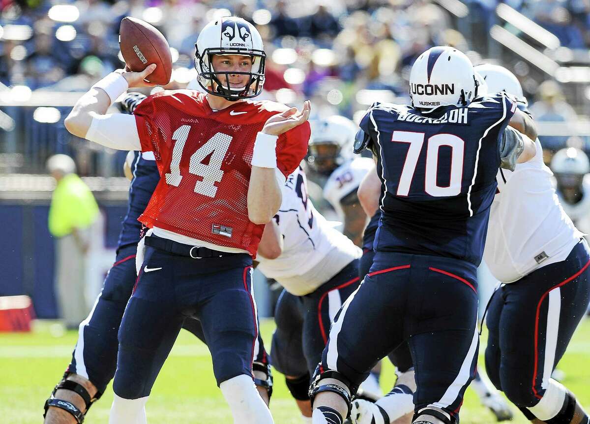 UConn quarterback Tim Boyle throws a pass during the Blue-White spring game in April at Rentschler Field in East Hartford.