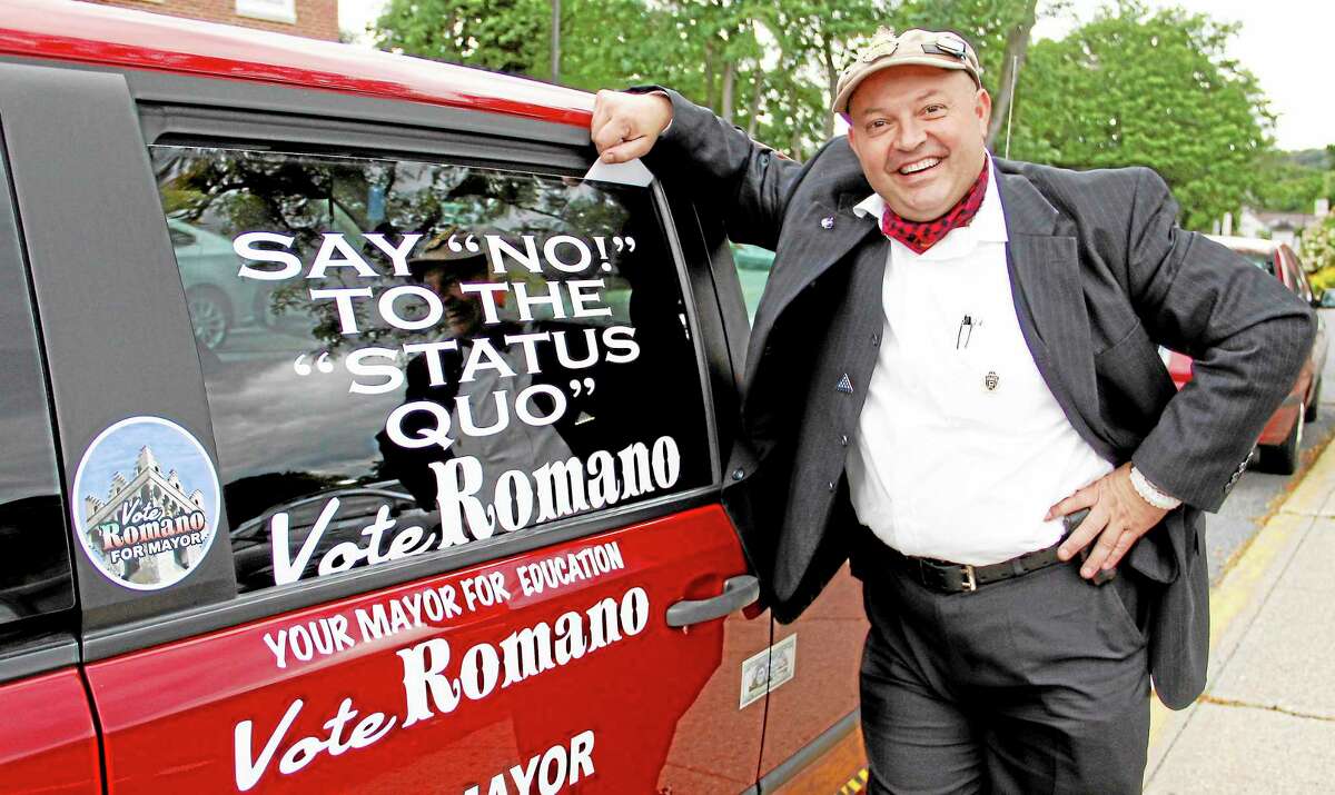 Independent mayoral candidate Giulio Romano stands in front of his van outside City Hall on Monday, Sept. 16, in Torrington.