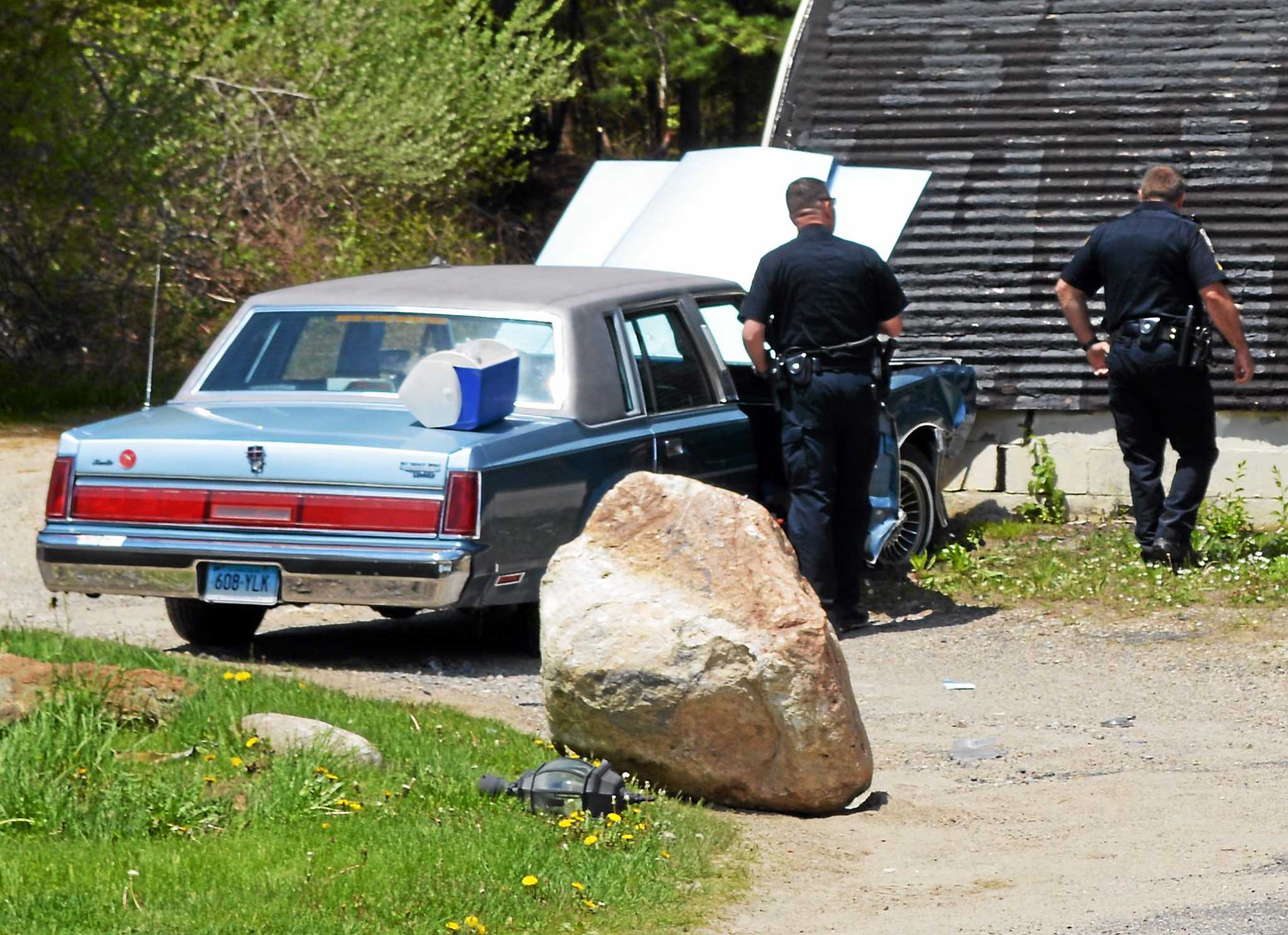 Car crashes into building in Torrington, driver hospitalized