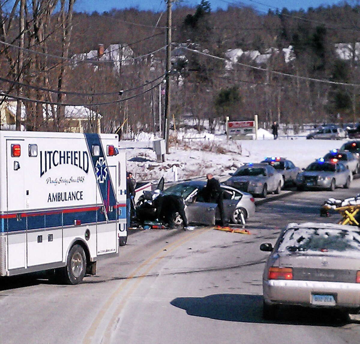 Emergency responders at the scene of a car crash on Route 202 in Litchfield Thursday.