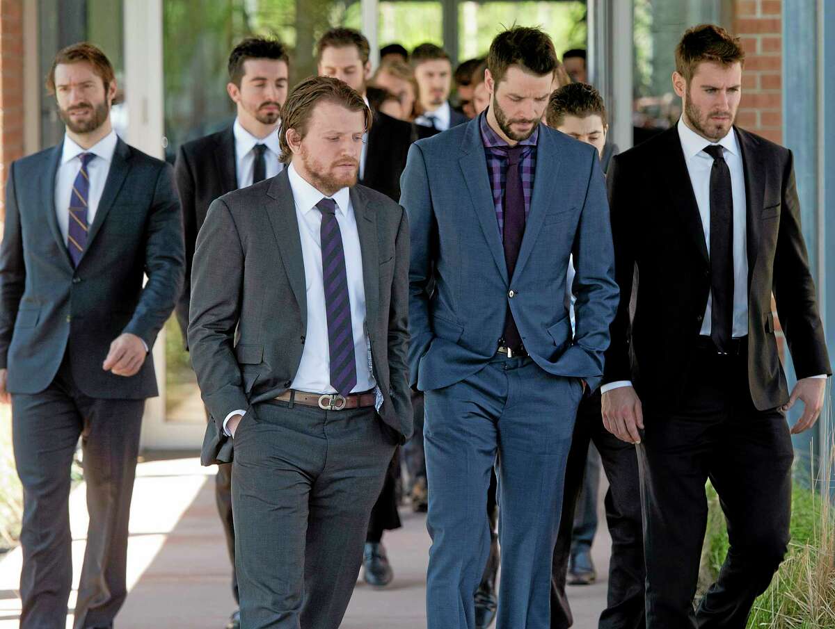 Rangers players leave a funeral home following service’s for the mother of teammate Martin St. Louis on Sunday in Laval, Quebec.
