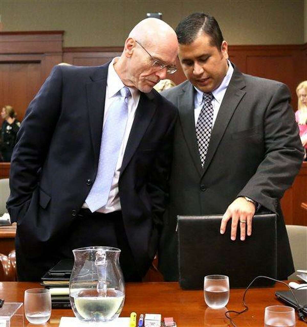 George Zimmerman, right, talks with defense attorney Don West in Seminole circuit court in Sanford, Fla., Monday, June 24, 2013. Zimmerman has been charged with second-degree murder for the 2012 shooting death of Trayvon Martin. (AP Photo/Orlando Sentinel, Joe Burbank,Pool)