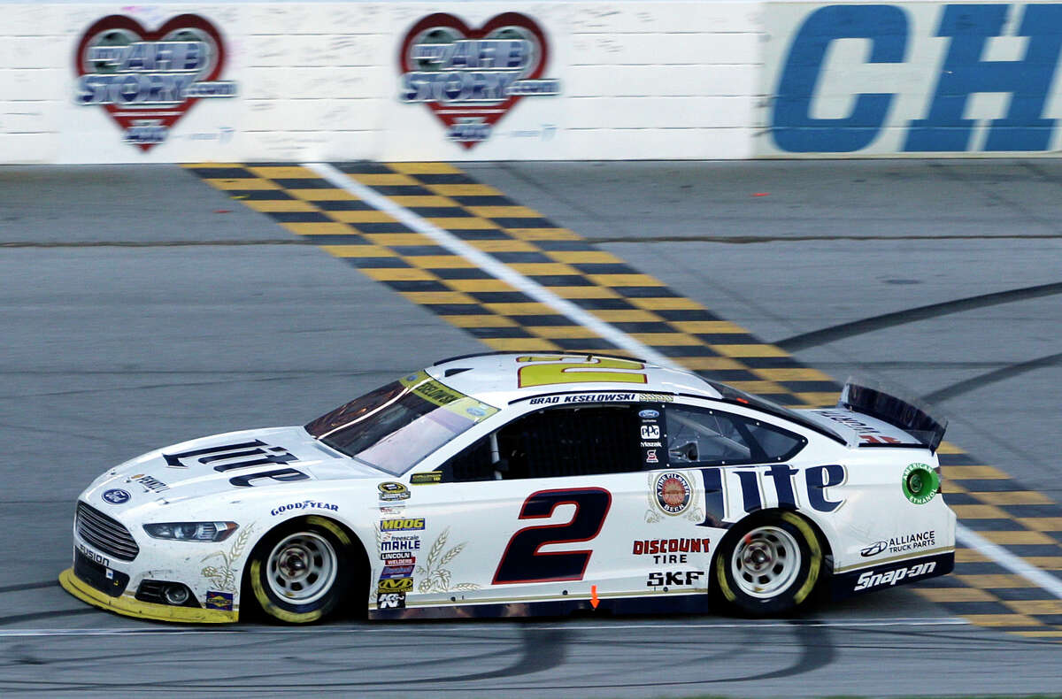 Brad Keselowski crosses the finish line as he wins the NASCAR Sprint Cup series race at Chicagoland Speedway on Sunday.