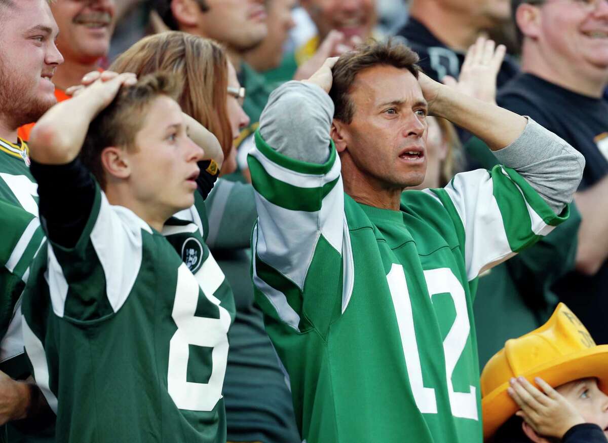 Jets fans react after a touchdown catch was called back because the team called a timeout before the ball was snapped in the fourth quarter on Sunday.