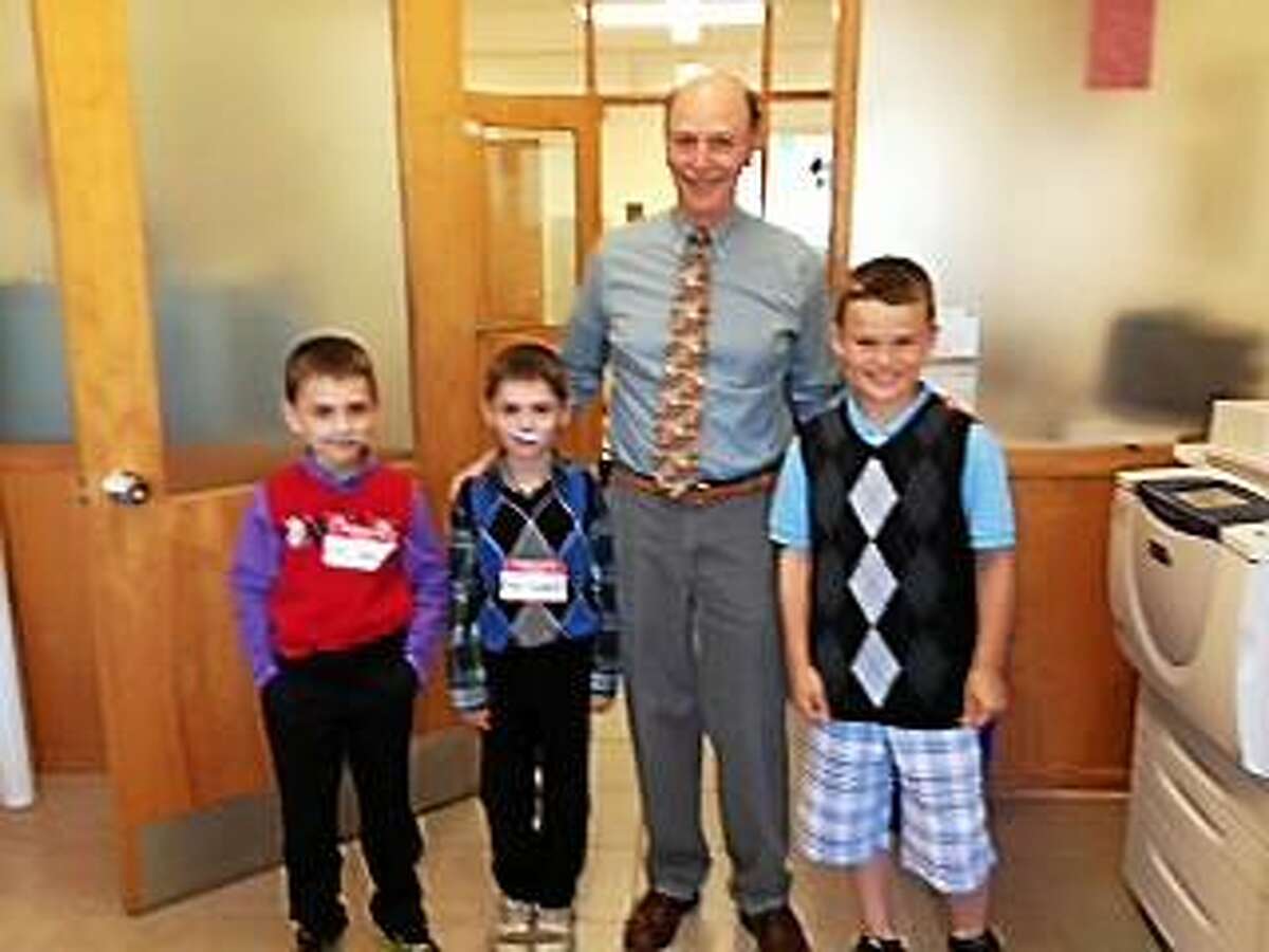 Contributed Photo - Children dressed up in sweater vests, ties and fake mustaches last Wednesday to surprise their principal with "Dress Like Mr. Weik day."
