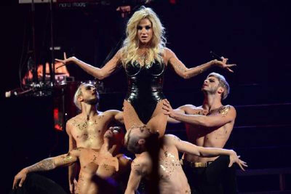 In this Sep. 22 2013 file photo, Ke$ha performs at the IHeartRadio Music Festival, in Las Vegas. Authorities in Muslim-majority Malaysia have banned a planned concert by U.S. pop singer Ke$ha after deciding it would hurt cultural and religious sensitivities.