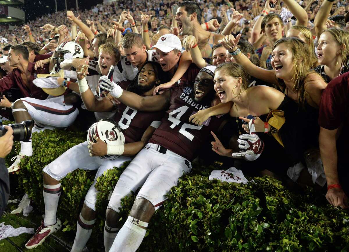 South Carolina players and fans celebrate their 38-35 win over Georgia ion Saturday.