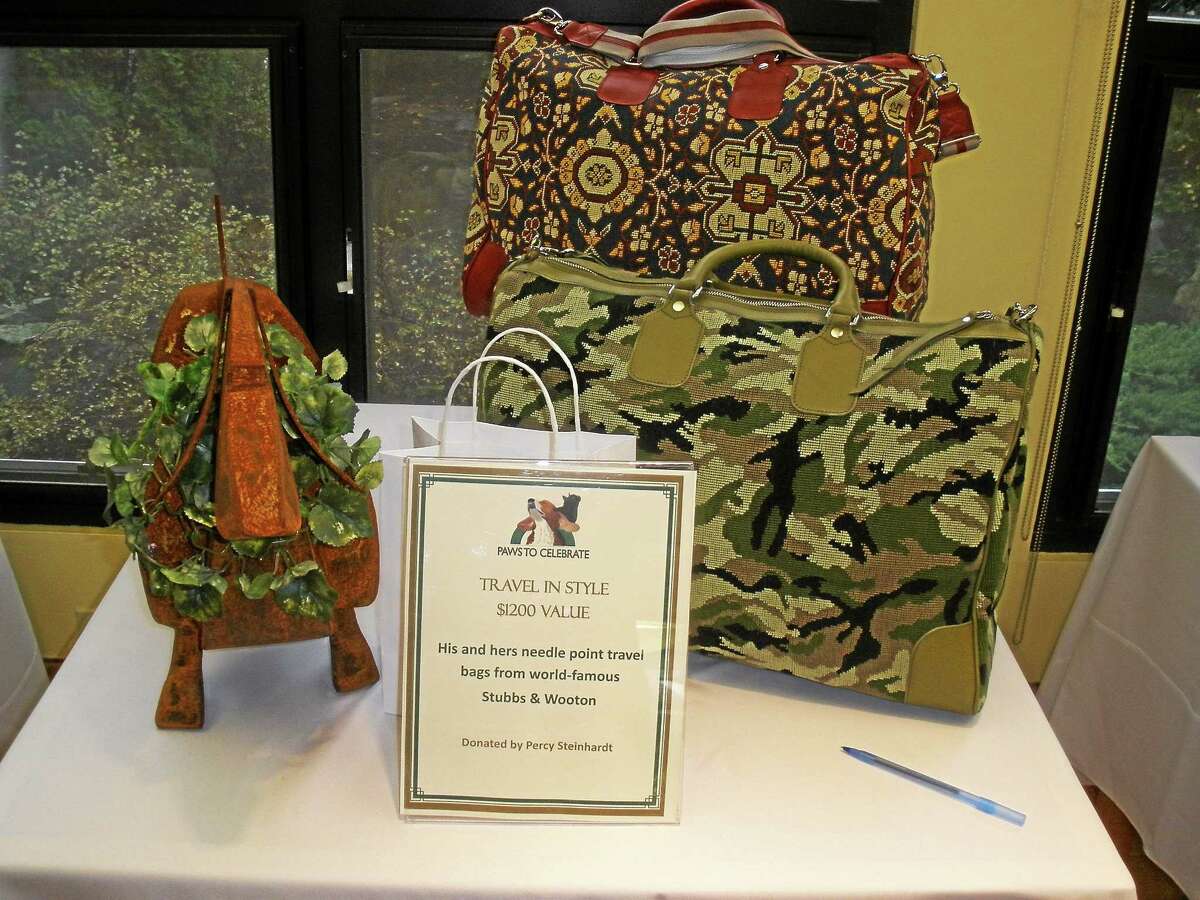 Stephen Underwood/Register Citizen Gifts were available for bidding at the Paws to Celebrate benefit for the Little Guild of St. Francis at the Litchfield Community Center.