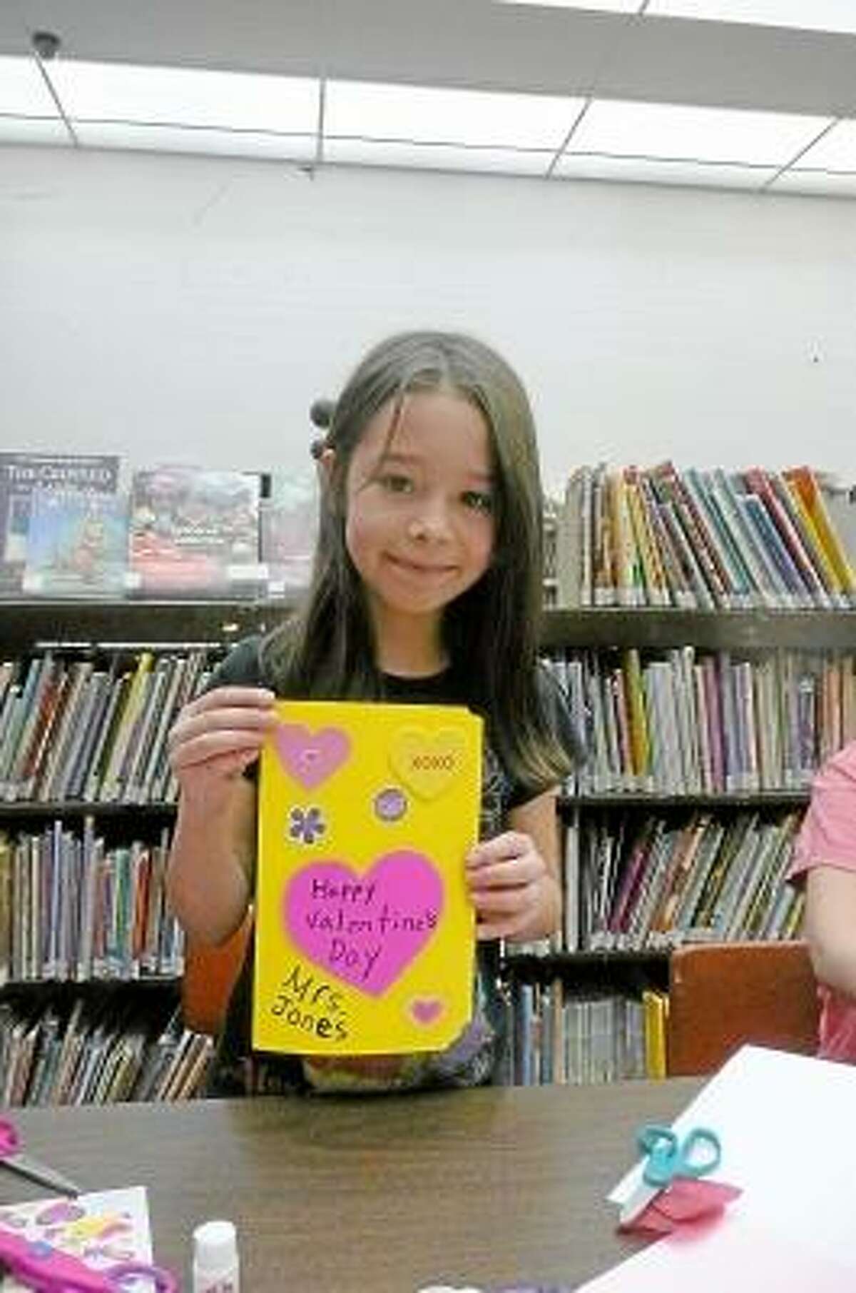 KATE HARTMAN/Register Citizen Liana Haxo, age 8, made a card for a teacher in her school.
