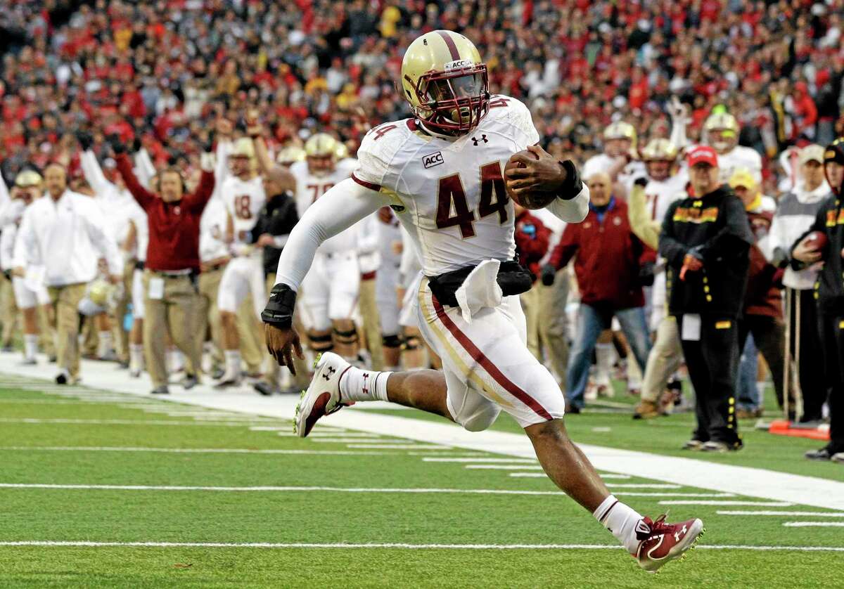 In this Nov. 23, 2013 file photo, Boston College running back Andre Williams jogs into the end zone for a touchdown against Maryland in College Park, Maryland.