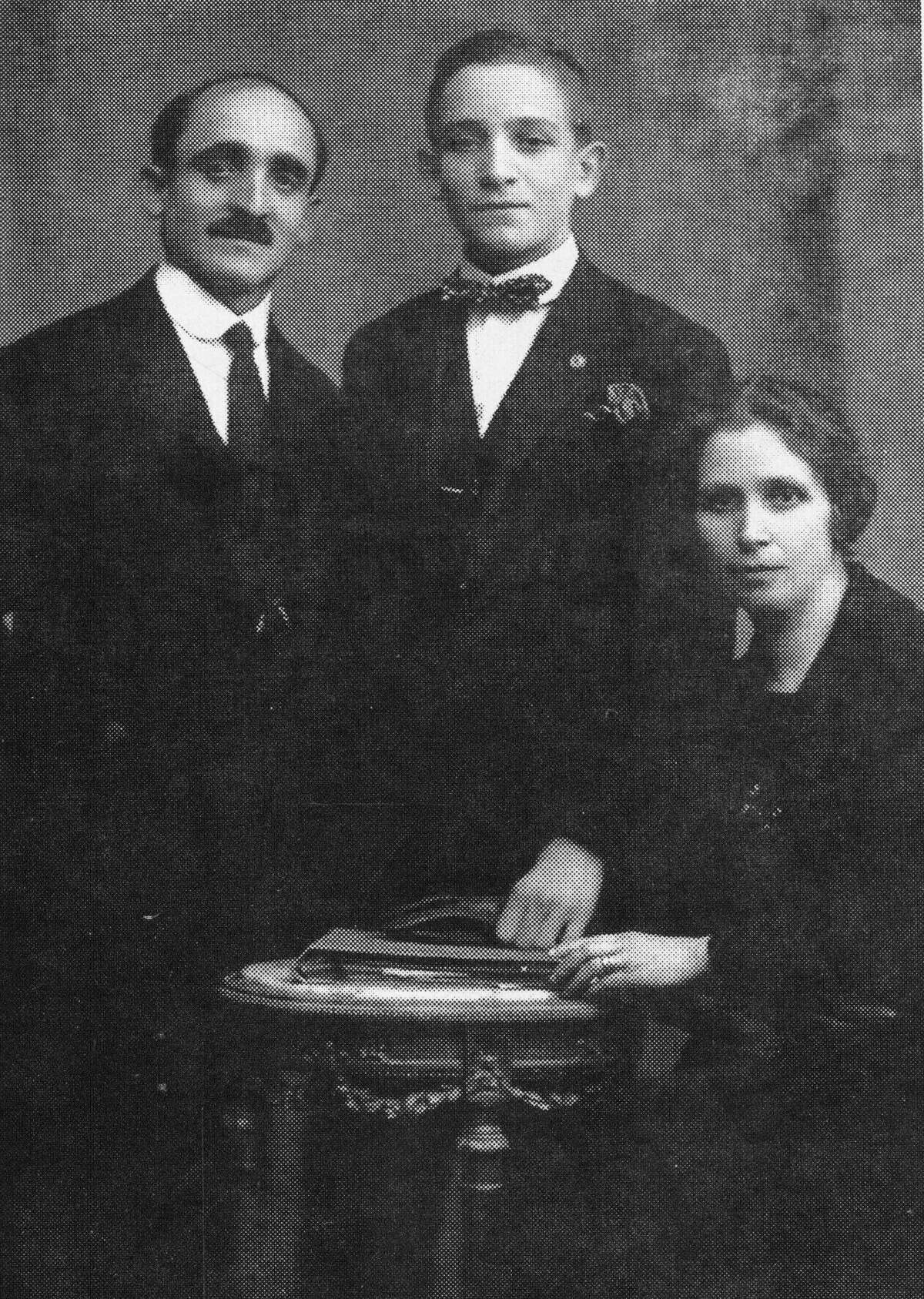 In this undated photo courtesy of Sergio Rubin, Giovanni Carlo Bergoglio, left, the grandfather of Pope Jorge Mario Bergoglio, poses with his son, Mario Jose Bergoglio, center, and his wife Margarita Vasallo in Buenos Aires, Argentina. Pope Francis will confront a piece of his own family history when he visits a WWI memorial on Saturday, Sept. 13, 2014. His grandfather, Juan Bergoglio, fought in the brutal Italian offensive against the Austro-Hungarian empire, surviving to impress upon the future pope the horrors of war. (AP Photo/Courtesy of Sergio Rubin, File)