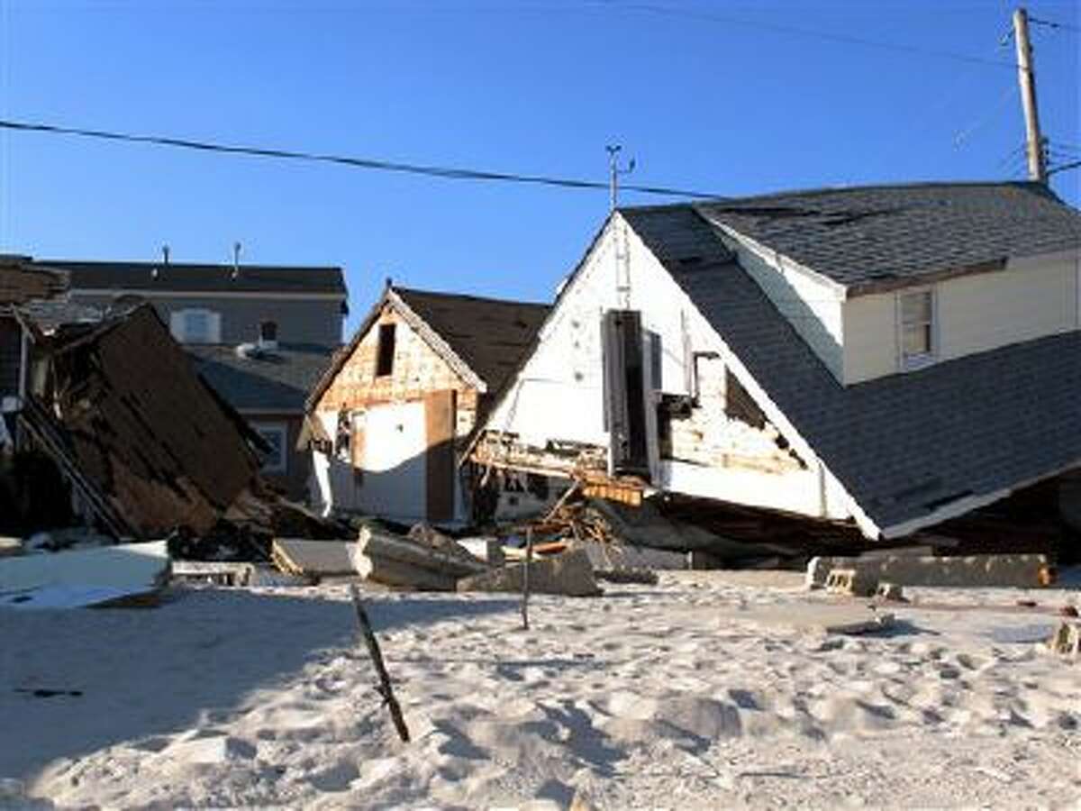 This Nov. 29, 2012, photo shows the wreckage of an oceanfront neighborhood in Toms River, N.J., one month after Superstorm Sandy pummeled it.