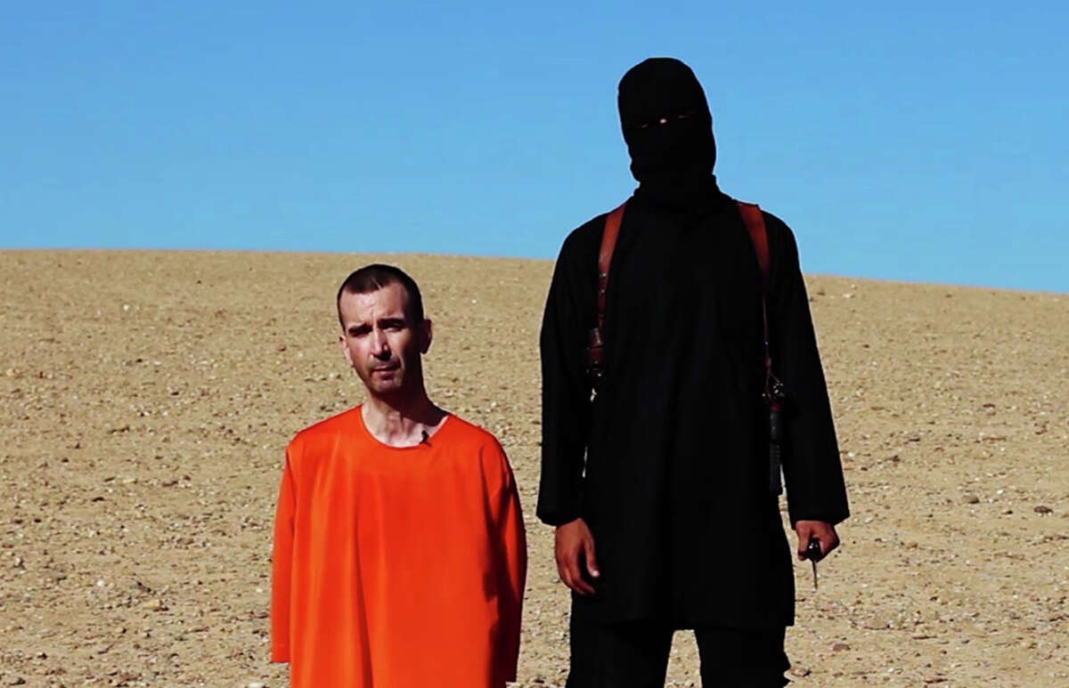 This image made from video posted on the Internet by Islamic State militants and provided by the SITE†Intelligence Group, a U.S. terrorism watchdog, on Saturday, Sept. 13, 2014, purports to show British aid worker David Haines before he was beheaded.