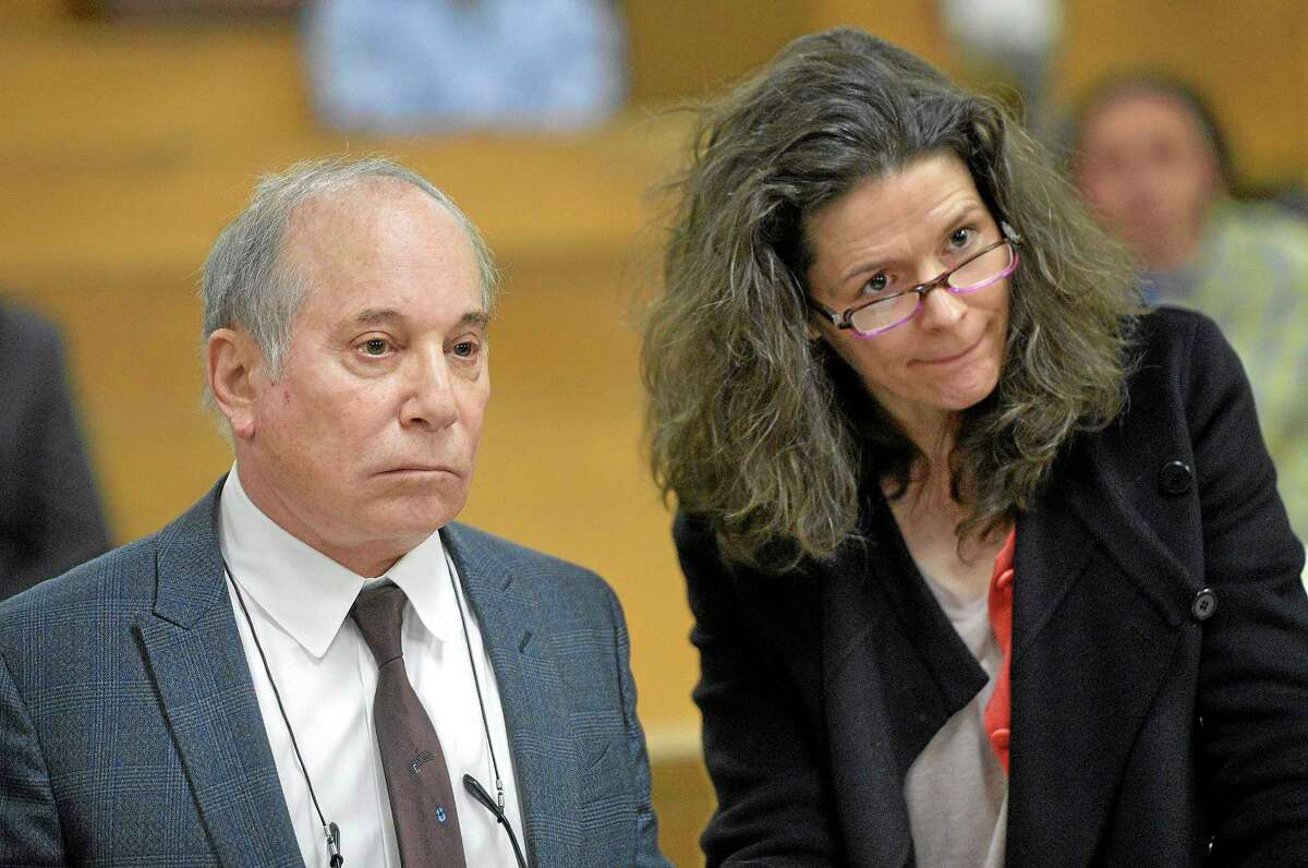 Singer Paul Simon, left, and his wife Edie Brickell appear at a hearing in Norwalk Superior Court on Monday April 28, 2014 in Norwalk, Conn. The couple were arrested Saturday on disorderly conduct charges by officers investigating a family dispute at their home in New Canaan, Conn. (AP Photo/The Hour, Alex von Kleydorff, Pool)