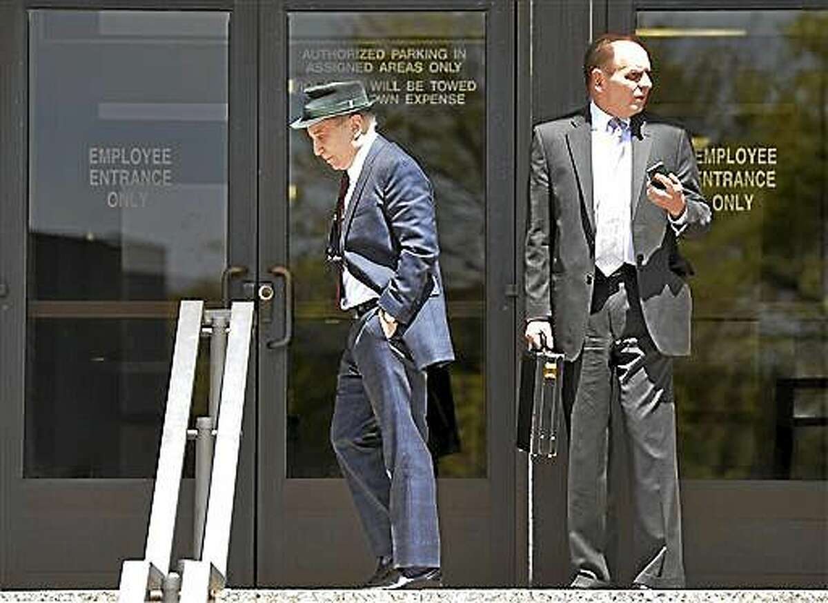 Singer Paul Simon, left, leaves Norwalk Superior Court with his attorney Stephen Hayes after a hearing Monday April 28, 2014 in Norwalk, Conn. Simon and his wife Edie Brickell were arrested Saturday on disorderly conduct charges by officers investigating a family dispute at their home in New Canaan. (AP Photo/The Hour, Alex von Kleydorff)